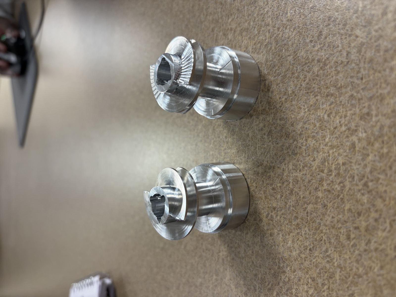Two inducers side by side. The right one was cut too deep, the left one is the corrected re-cut.