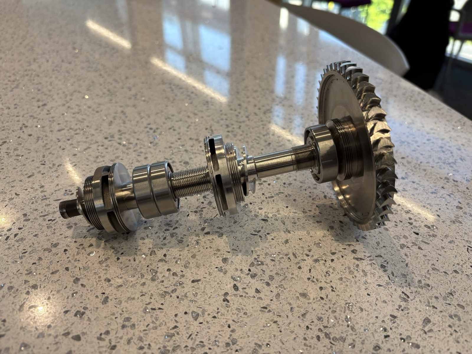 The assembled turbopump rotor, turbine wheel at one end and the pump end at the other